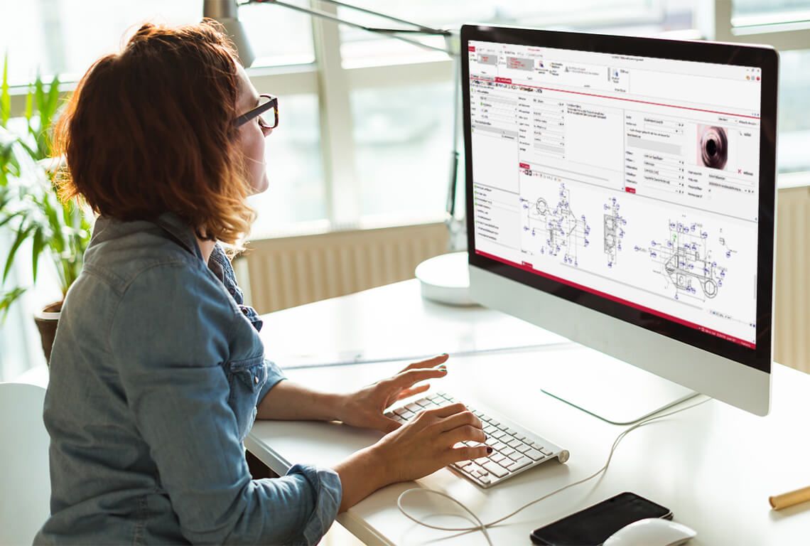 A woman working on an 8D on the computer