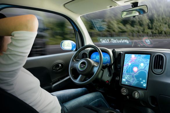 Person sitting in self-driving car
