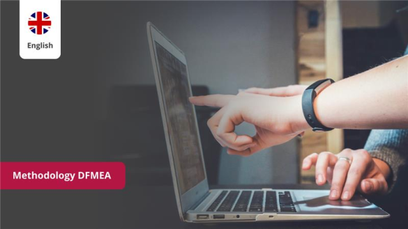 Two people review the Design FMEA methodology on a laptop according to the AIAG/VDA standard for quality management.