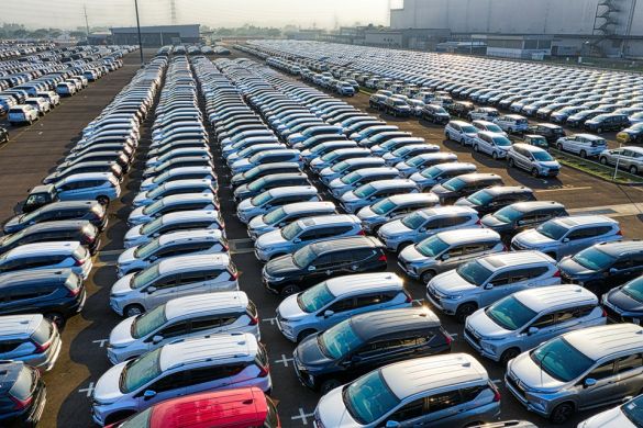 Top view of a company site with a large number of new vehicles parked on it