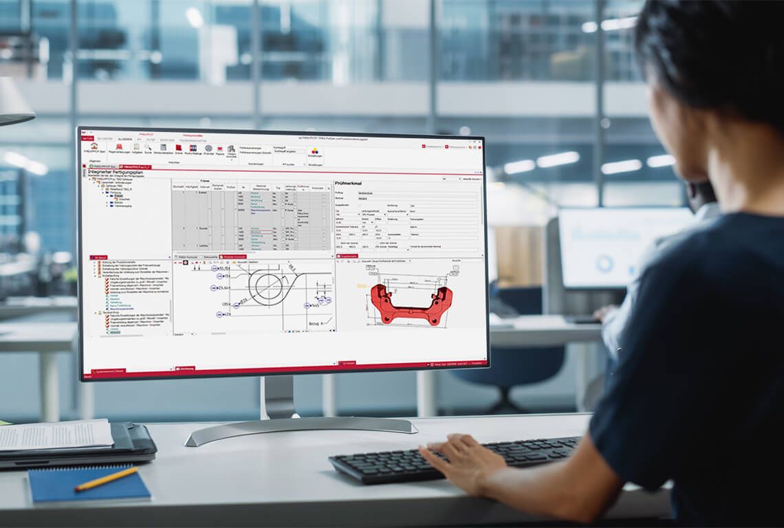 A woman creates an inspection plan on the computer using a 2D drawing.