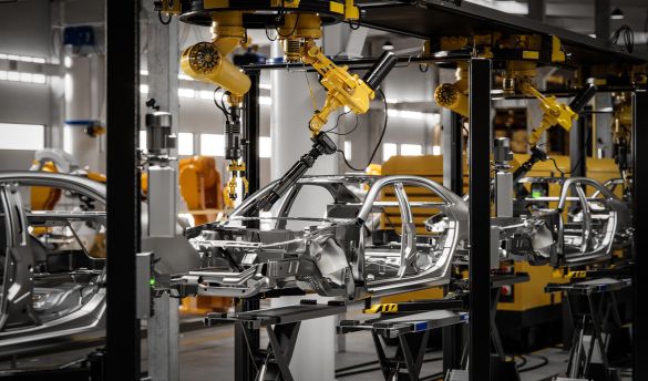 Automated robot arm welds car bodies